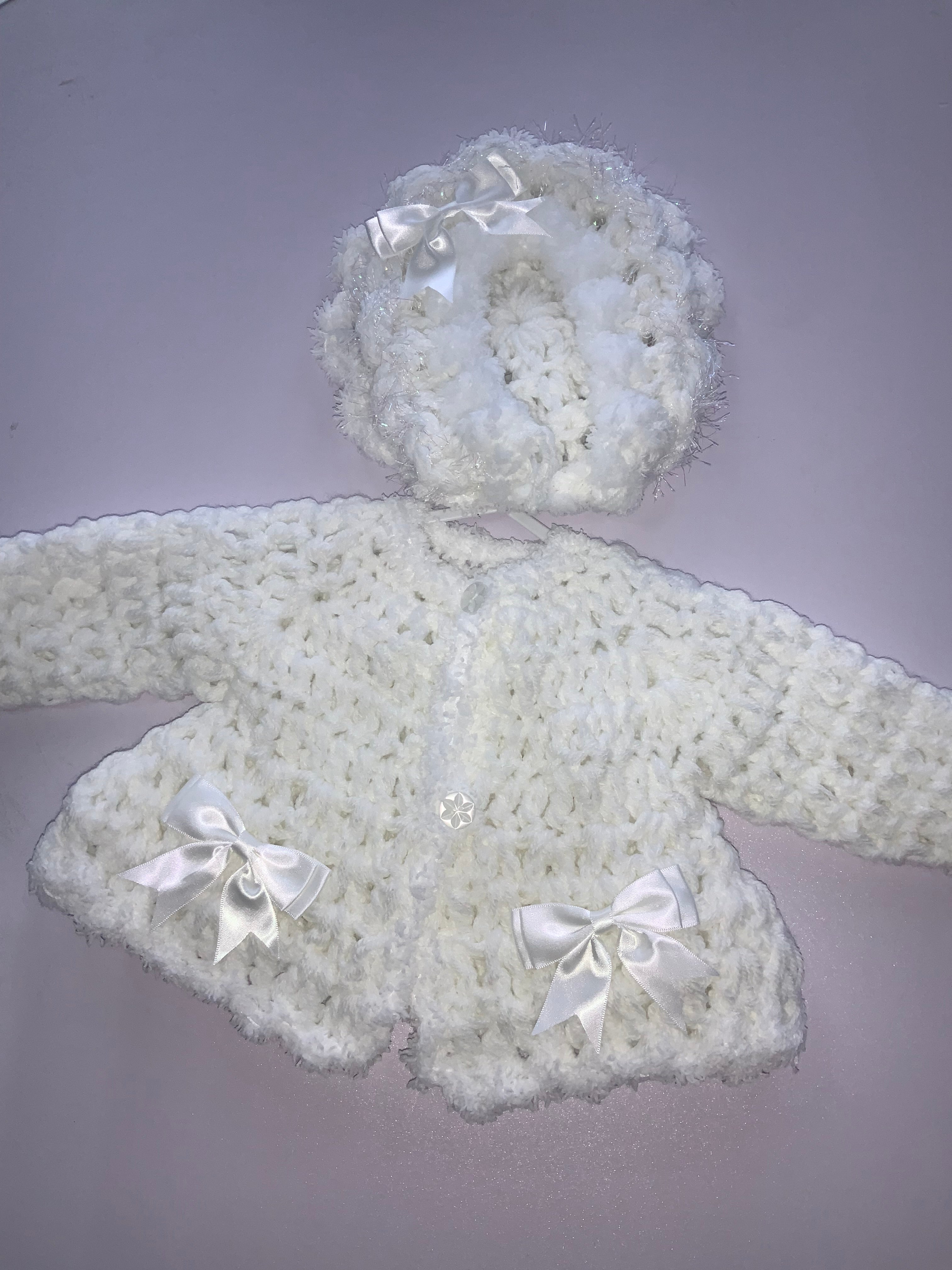 Crocheted cardigan and bonnet 06242344