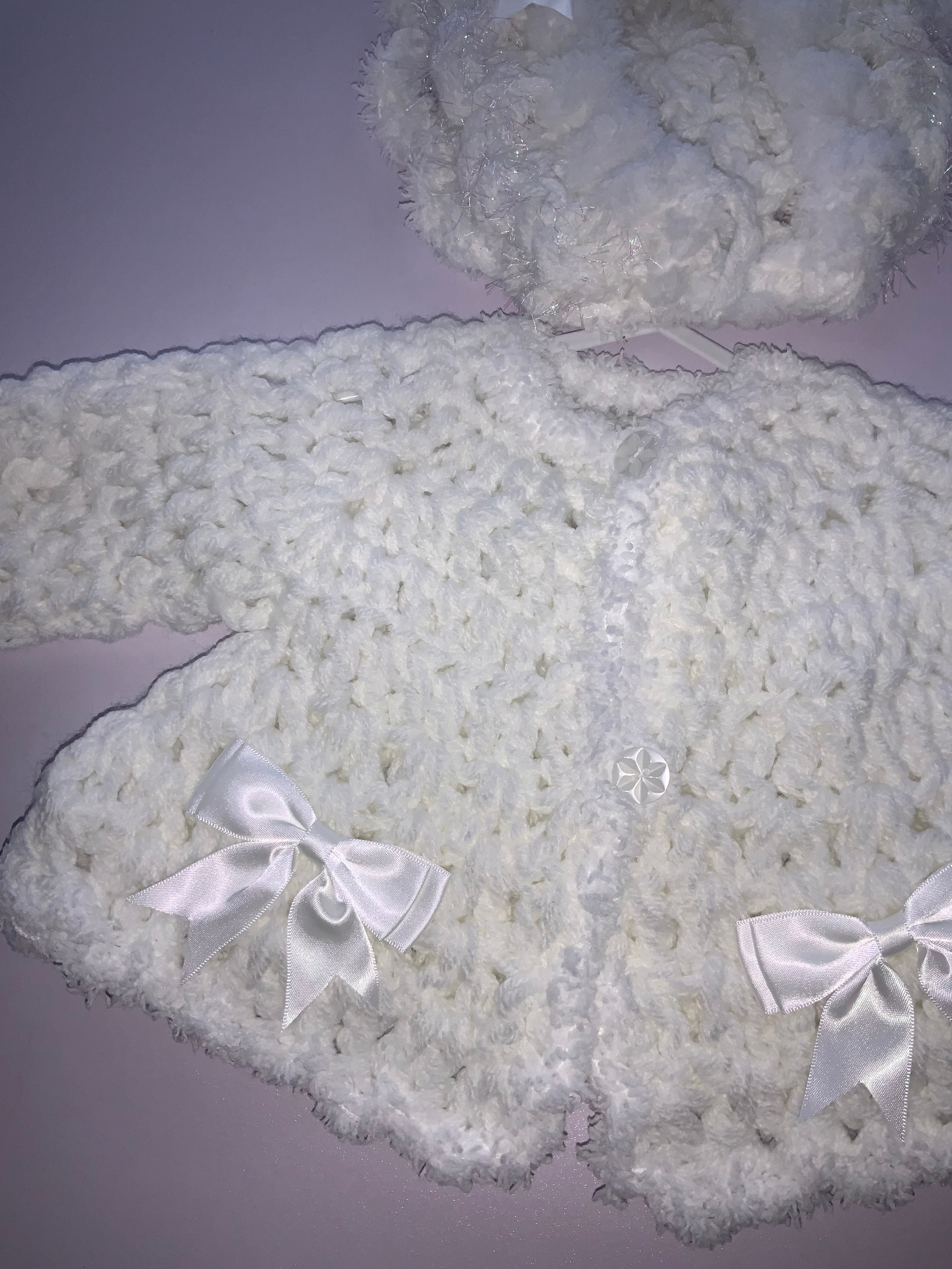Crocheted cardigan and bonnet 06242344